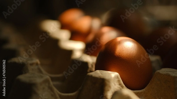 Fototapeta Chicken eggs placed in a stall With the morning light in the kitchen