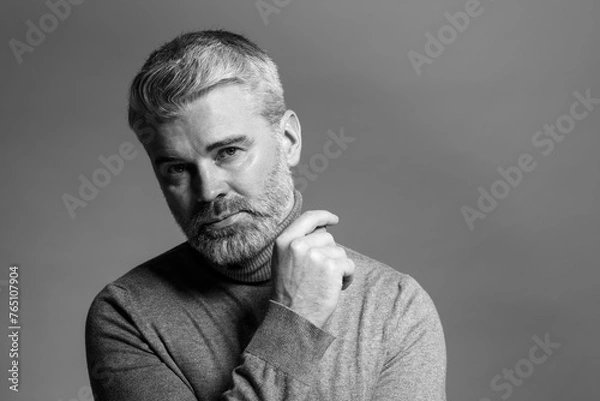 Fototapeta Portrait of handsome man on grey background, space for text. Black and white effect