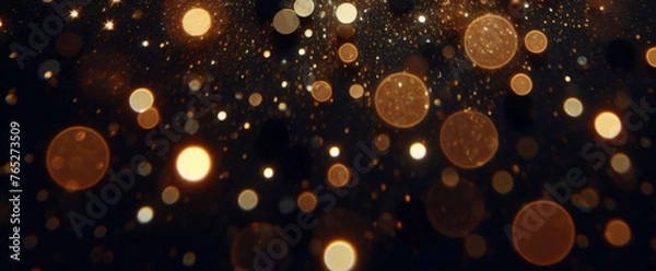 Fototapeta ゴールドの輝き粒子は、背景を抽象化します。ネイビー ブラックの背景にクリスマス黄金の光輝く粒子のボケ味。休日のコンセプト。抽象的な背景と金の粒子。