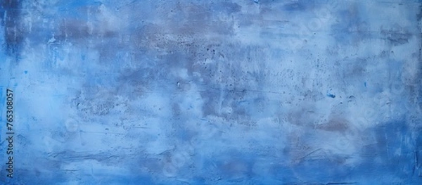 Fototapeta An artwork depicting a vibrant blue wall adorned with an intricate pattern in white and shades of blue