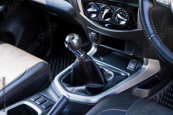 Fototapeta automatic transmission shift selector in the car interior. Closeup a manual shift of modern car gear shifter. 4x4 gear shift	
