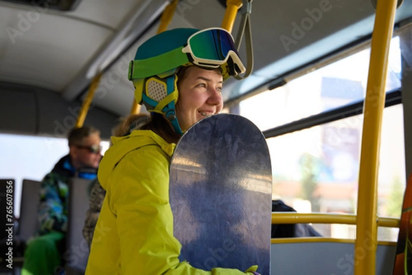 Fototapeta Joyful Snowboarder Riding Bus to Slopes