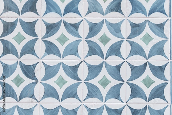 Fototapeta Typical Lisbon facade with its vintage geometrical tiles in Portugal.