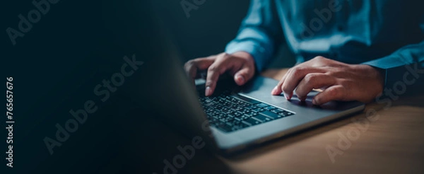 Fototapeta internet, keyboard, working, information, security, network, office, person, data, communication. A person is typing on a laptop computer. Concept of productivity and focus.