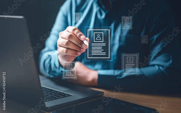 Fototapeta document, management, marketing, information, search, social, corporate, network, system, communication. A man is holding a stylus with a drawing of a person. Concept of creating a digital resume.