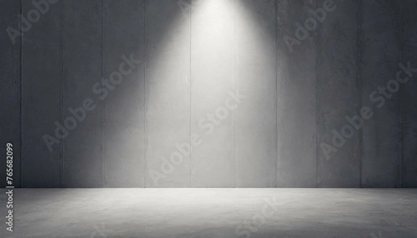 Fototapeta Abstract empty, modern concrete room with spot light shining down on the back wall 
