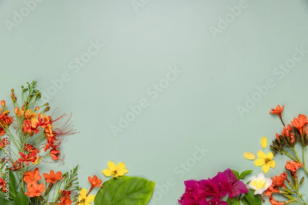 Fototapeta Picture frame of Thai flowers on green background.