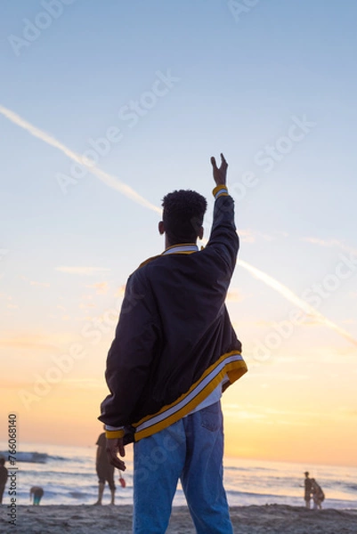 Fototapeta Boy looking at the sunset