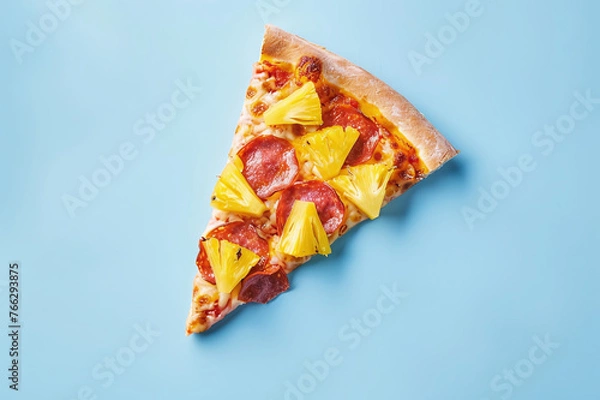 Fototapeta Appetizing slice of Hawaiian pizza on a blue background and space for text
