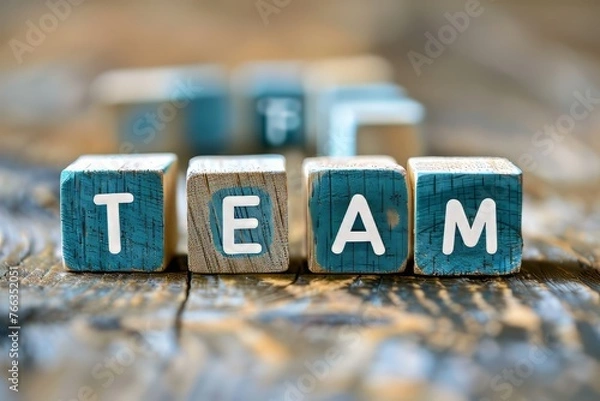 Fototapeta Wooden cubes with the text "TEAM" in the style of a business team concept