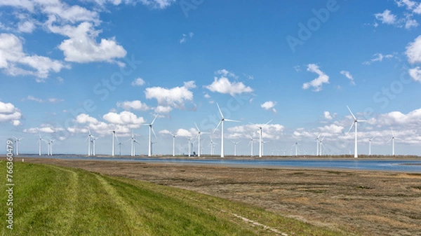 Obraz 34 windmolens wekken elekriciteit op bij de Krammersluizen in Zeeland. Deze turbines behoren tot het Windpark Krammer en is het grootste particuliere windpark van Nederland