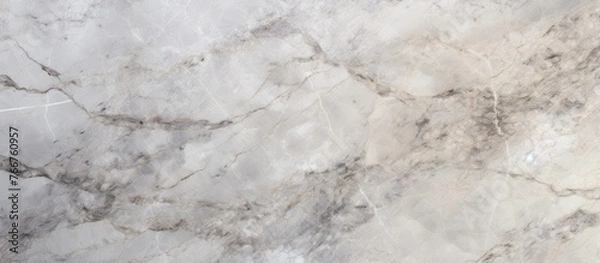 Fototapeta White marble featuring a distinctive pattern in shades of gray and black, ideal for elegant interior design projects