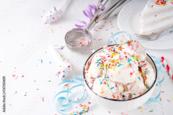 Fototapeta Birthday cake ice cream. Bowl portion of birthday cake taste white vanilla ice cream with colorful sugar sprinkles, funfetti with happy birthday decorations on table, copy space