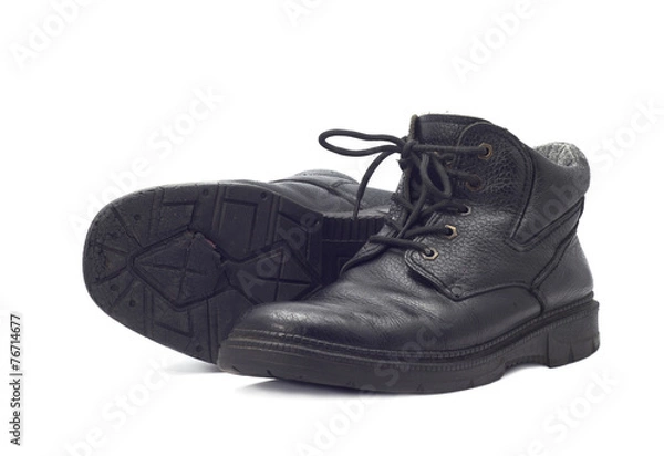 Fototapeta Old boots isolated on white background