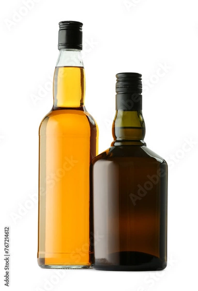 Fototapeta Different sorts of whiskey in glass bottles isolated on white
