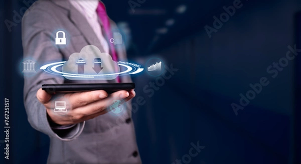 Fototapeta businessman uploads and downloads data from the cloud managing his banking and business data from the security of his smartphone