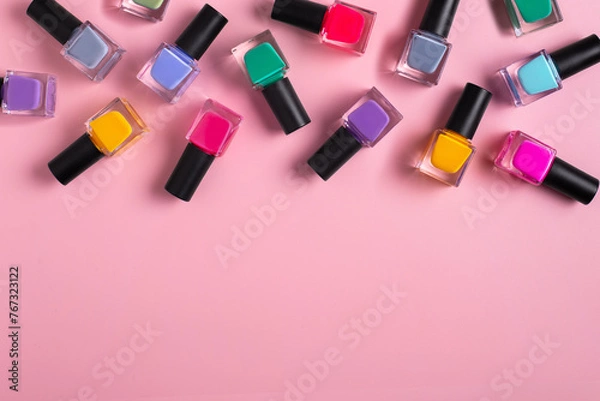 Fototapeta Pattern background of bottles colorful nail polish, top view, copy space