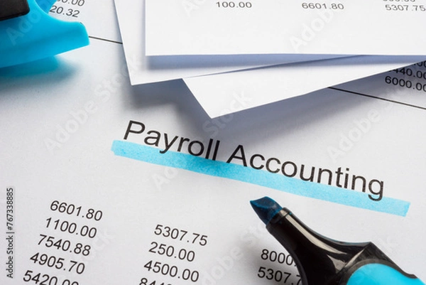 Obraz Documents with payroll accounting and marker.