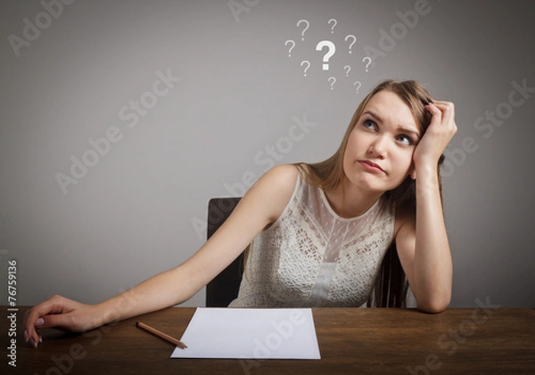 Obraz Girl in thoughts. Question marks.