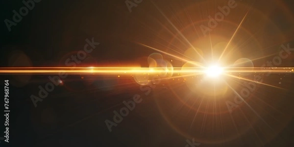 Fototapeta A yellow lens flare with a black background