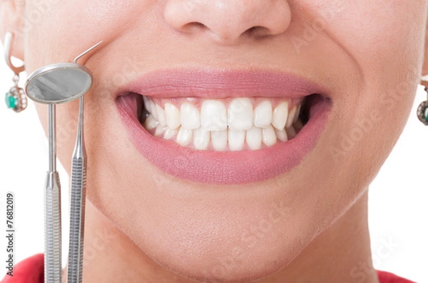 Obraz Perfect teeth and dentist tools