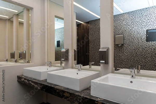 Fototapeta Toilet sink interior of public toilet with washstand for washing hands and mirror.