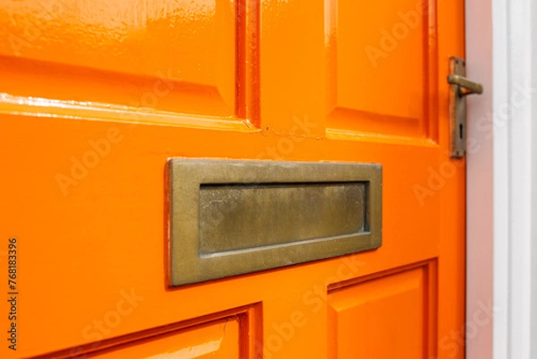 Obraz Orange front door cross section with gold letterbox and golden door handle 
