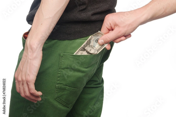 Obraz Pickpocket stealing a mans money from back pocket