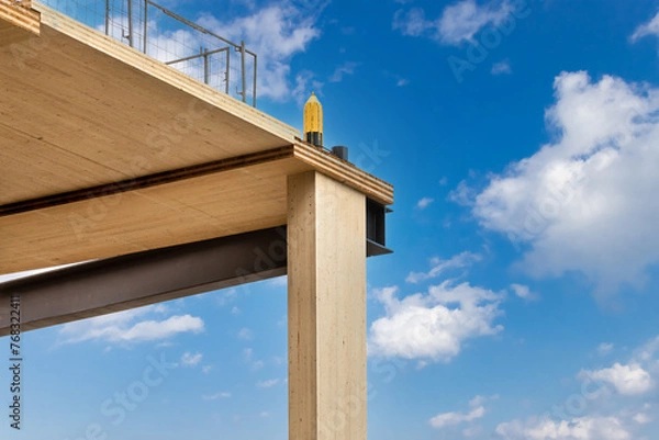 Fototapeta Detail of laminated support columns and floor panels of a mass timber multi story, sustainable, residential high rise apartment or office building construction project