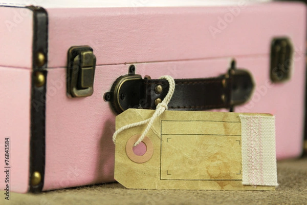 Obraz Pink retro vintage suitcase with blank paper tag