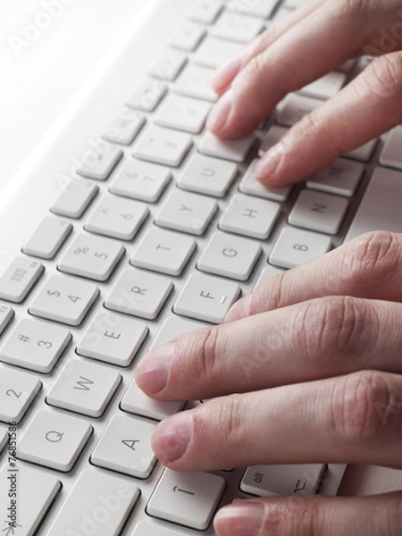 Fototapeta Typing on computer keyboard