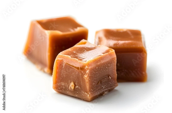 Fototapeta Cubes of caramel isolated on white background