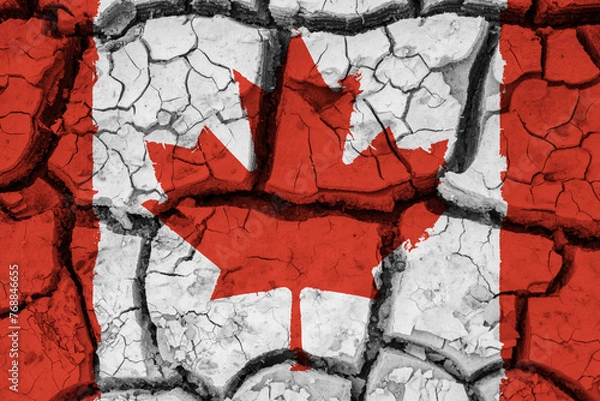 Fototapeta Dry soil pattern on the flag of Canada. Country with drought concept due to climate change. Water problem. Dry cracked earth country.