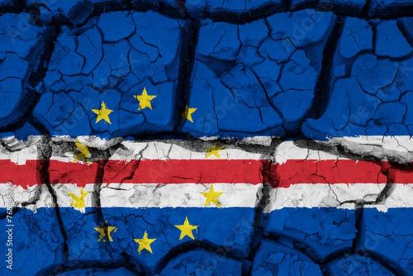 Fototapeta Dry soil pattern on the flag of Cape Verde. Country with drought concept due to climate change. Water problem. Dry cracked earth country.