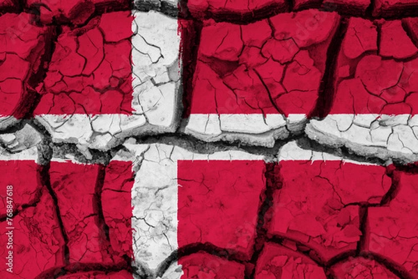 Fototapeta Dry soil pattern on the flag of Denmark. Country with drought concept due to climate change. Water problem. Dry cracked earth country.