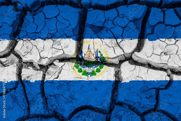Fototapeta Dry soil pattern on the flag of El Salvador. Country with drought concept due to climate change. Water problem. Dry cracked earth country.