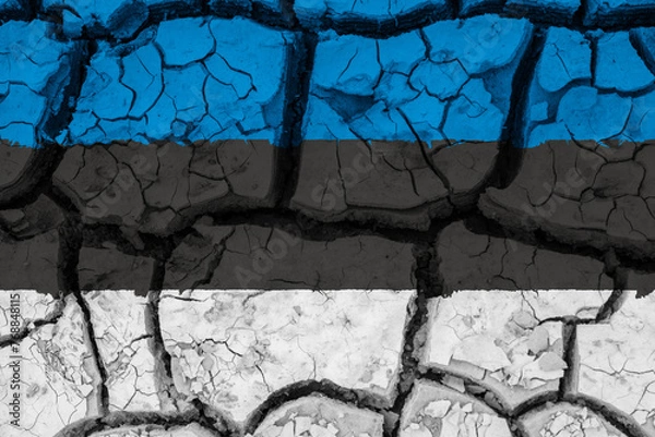 Fototapeta Dry soil pattern on the flag of Estonia. Country with drought concept due to climate change. Water problem. Dry cracked earth country.