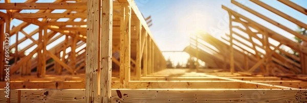 Obraz New Residential Housing Construction, Wooden Framing and Structures Under a Clear Blue Sky