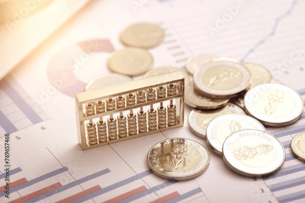 Fototapeta Abacus and Coins Placed on Data Sheets - Concepts of Monetary Finance
