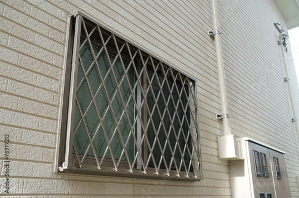 Fototapeta 住宅の面格子のついた窓