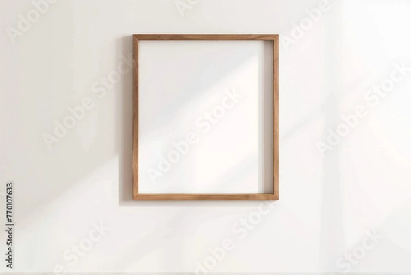 Fototapeta White Wall With Hanging Wooden Frame, Frame Mock Up