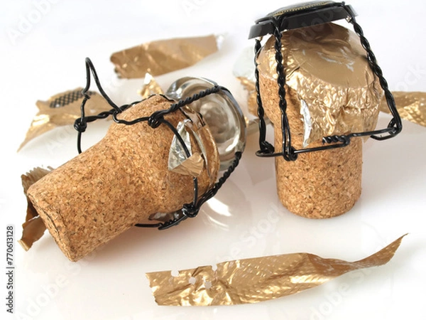 Fototapeta two champagne corks over white background