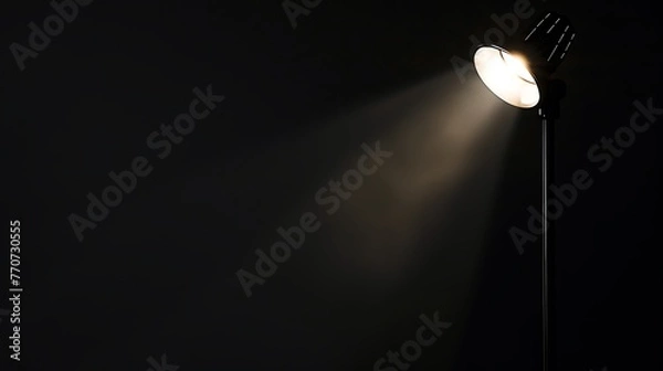 Fototapeta Spotlight illuminating the empty space on a dark background.