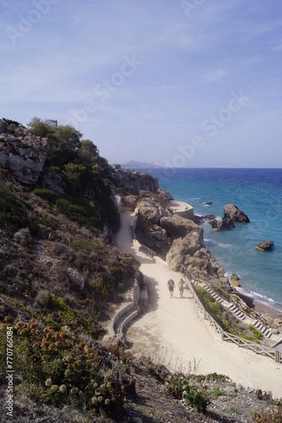 Fototapeta Seaside promenade along Kato Petres Beach in Rhodes, Greece
