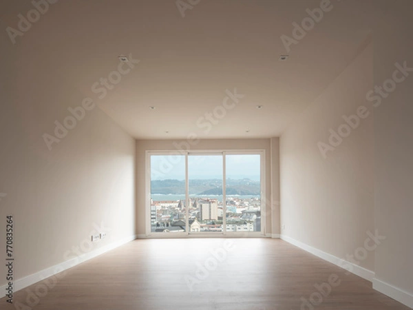 Fototapeta New apartment, empty, ready to move in. Interior view of the living room looking towards the window