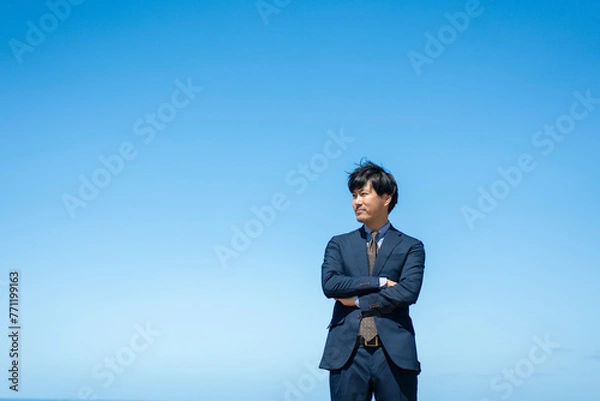Fototapeta 青空とビジネスマン