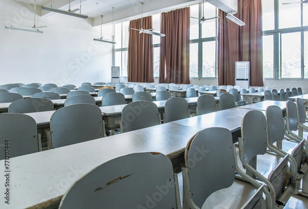 Fototapeta In university classrooms, tables and chairs are neatly arranged