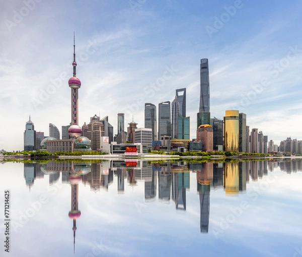Fototapeta Looking across the Pujiang River at the skyscrapers in the Shanghai Pudong New Area, the financial center of China, on a sunny summer day