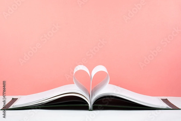 Obraz Old open hardback book, page decorate into a heart shape for love in Valentine's. love with open book heart.