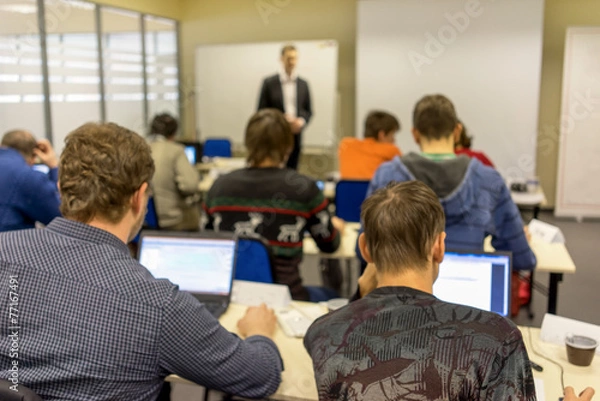 Obraz people sitting rear at the computer class